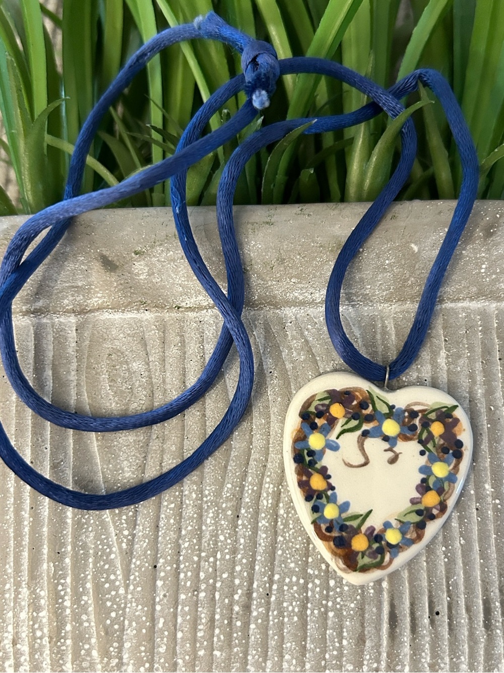 Ceramic heart Pendant Necklace on a Blue Cord floral design